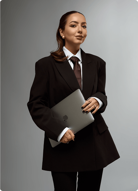 Shelby Sapp seated in a black blazer